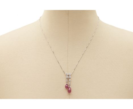 A PLATINUM, RUBY AND DIAMOND PENDANT NECKLACE A platinum necklace with a pendant consisting of diamonds and two ruby drops   