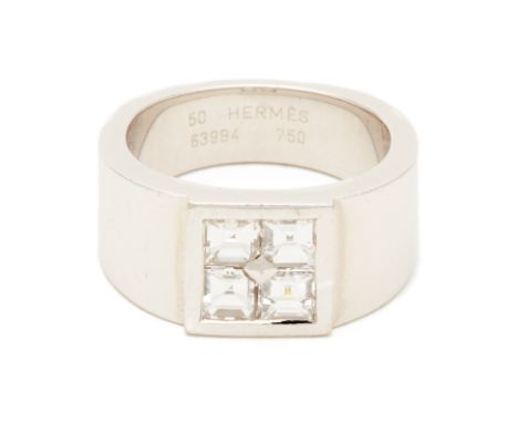 A HERMES DIAMOND RING An 18k white gold band with four central square cut diamonds   Marked Hermes, 750 and 63994 Hong Kong s
