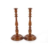 A pair of golden oak bespoke candlesticks by Titch