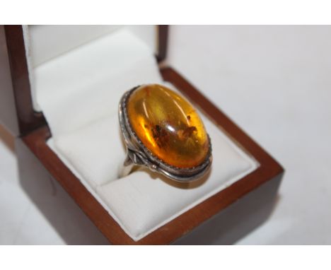 A silver and amber set dress ring, ring size R