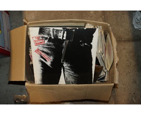 A box of LP's and 45rpm records to include Beatles, John Lennon, George Harrison, Paul McCartney, The Rolling Stones "Sticky 