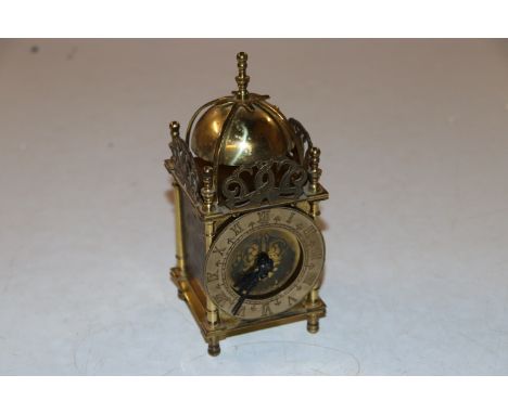A brass cased lantern clock
