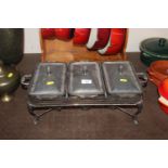 A plated three compartment food warmer with spirit