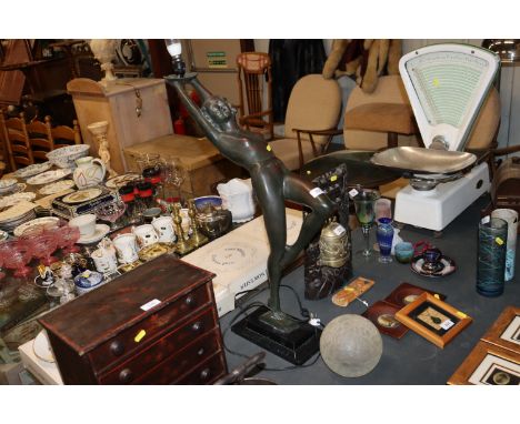 An Art Deco style bronzed table lamp in the form of a dancing girl holding aloft a lamp with frosted glass globe, AF, 84cm hi