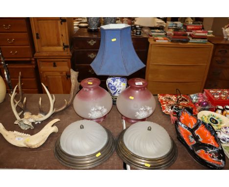 A blue and white table lamp and shade; a pair of opaque glass light shades and a pair of brass and frosted glass ceiling ligh