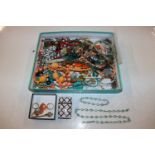 A tray containing various costume jewellery, wrist