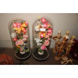 A pair of French glass domes and contents of artif