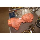 A terracotta pottery bust