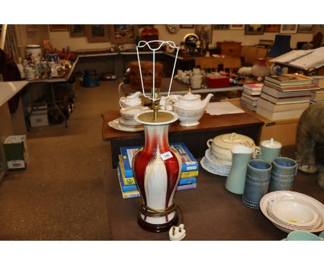 A red running glazed pottery table lamp
