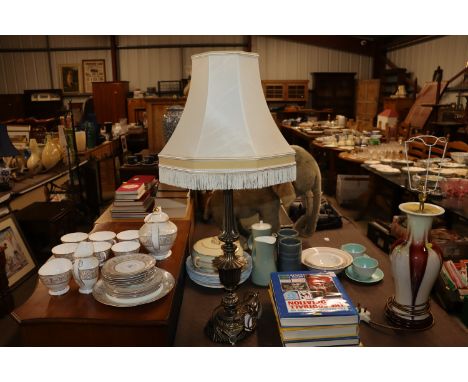 A brass table lamp and shade
