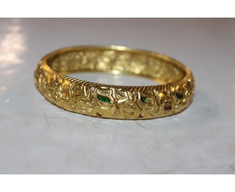 A yellow metal bangle, tests as 21ct, total weight approx. 31gms 