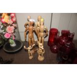 Six artists lay dolls