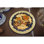A Longpark of Torquay terracotta charger with flor