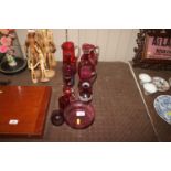 A collection of various cranberry and other ruby g
