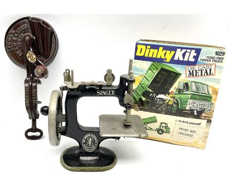 Dinky Kit No.1029 Ford D800 Tipper Truck in unopened original packaging; American Singer child's sewing machine; Spong's tabl