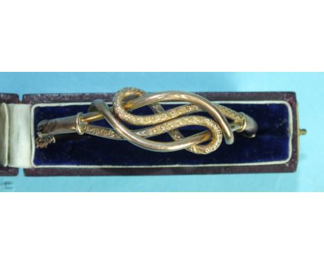 A Victorian 9ct gold hinged bangle of knot design, 8.4g, cased.