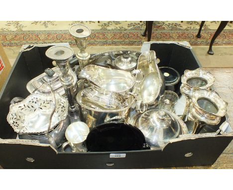 A three-piece silver-plated oval tea service and other plated items.