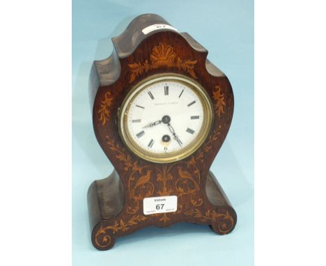 A 19th century rosewood and marquetry balloon-shaped mantel timepiece with white enamel dial, (damaged) and drum movement, bo