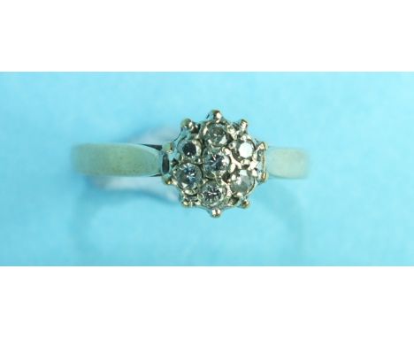 A diamond cluster ring set seven brilliant-cut diamonds, in 9ct gold mount, size J½, 2.3g.