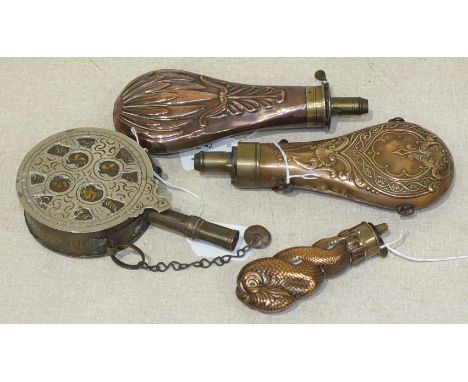 An unusual copper and brass powder flask in the form of two writhing squid, 12cm long and three other powder flasks, (4).