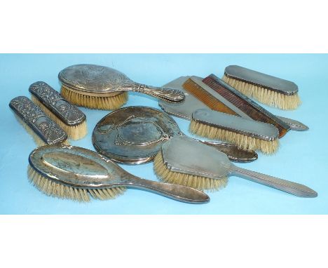 A five-piece engine-turned dressing table set of Art Deco style, Birmingham 1937 and other silver-backed dressing table items