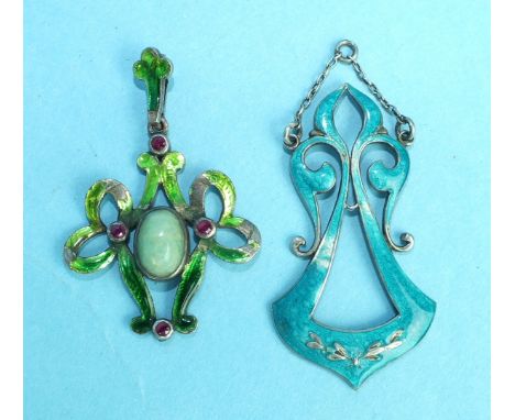 An Art Nouveau green-enamelled white metal pendant of open bow form, collet-set a jade cabochon and four round-cut rubies, un