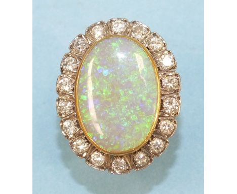 A large opal and diamond cluster ring, the oval opal, 22 x 15mm, collet set within a surround of eighteen brilliant cut diamo