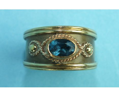 A 9ct yellow Welsh gold wide ring set blue topaz, size P, 8.2g.