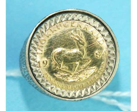 A 1984 1/10 Krugerrand coin mounted in a 9ct gold ring, size N, 7.6g.