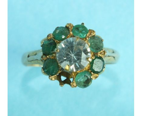 A 22ct gold ring set emerald and synthetic white stone cluster, (one setting vacant), size M, 3.7g.