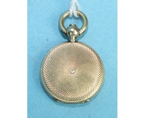 A small Edwardian locket with engine-turned engraving.