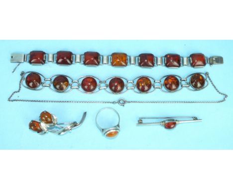 A 935-silver-mounted amber bracelet, a German 835-silver-mounted amber necklace, two similarly-mounted amber brooches and a r