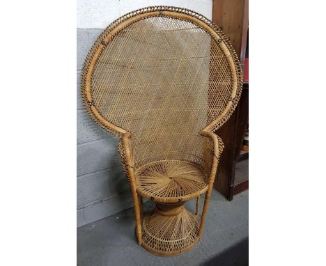 A mid century/vintage wicker peacock chair