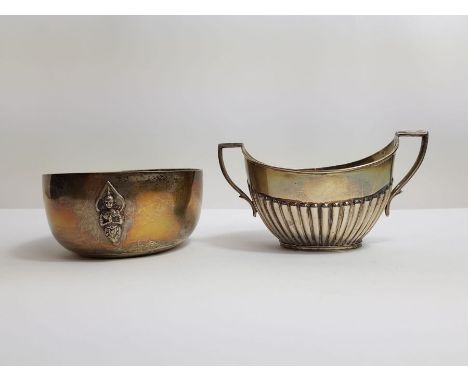 A silver hallmarked two handled sucrier, James Deakin &amp; Sons, along with silver bowl marked "sterling", with decoration o