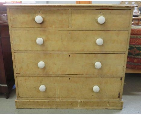 A Victorian pine chest of drawers, of two short drawers and three long, with white ceramic handles, 98cm high, 107cm high, 51