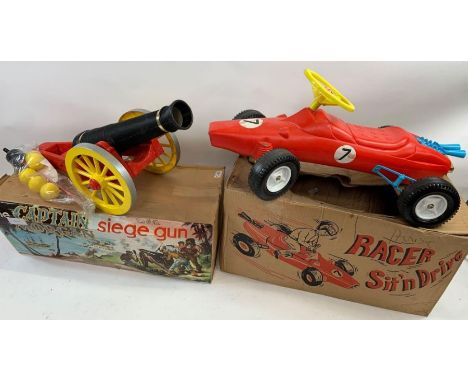 New/old stock - A boxed Captain Morgan Siege Gun, along with a red racing car, boxed