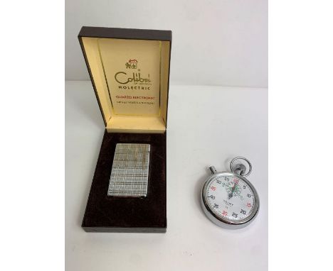 A c.1970's Colibri lighter in original box together with a Dolmy stopwatch 