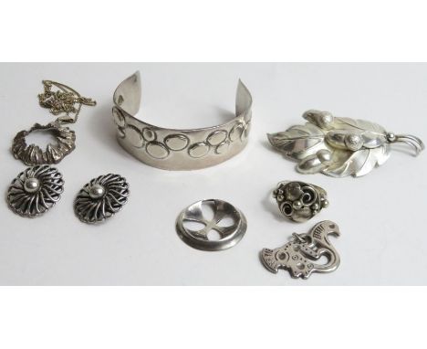 A collection of Scandinavian silver jewellery, comprising; a bangle; a ring; a pendant on chain; two pendants; an oak leaf br