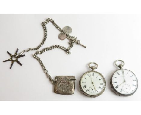 A silver cased open faced pocket watch with white enamel dial and engine turned back with a central shield motif, along with 