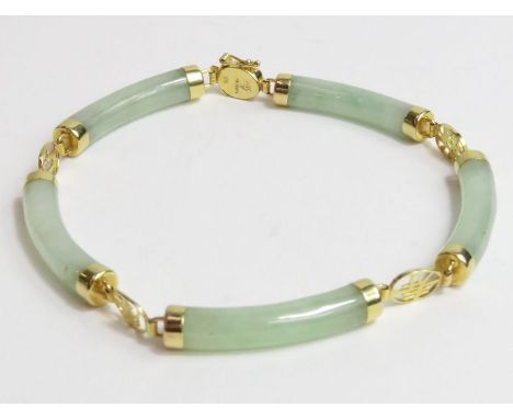 A 14ct gold bracelet set with five shaped jade bars, with pictogram connectors, and a fold over figure of 8 safety catch, 10.