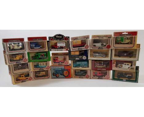 A collection of vintage boxed car models including Lledo and others 