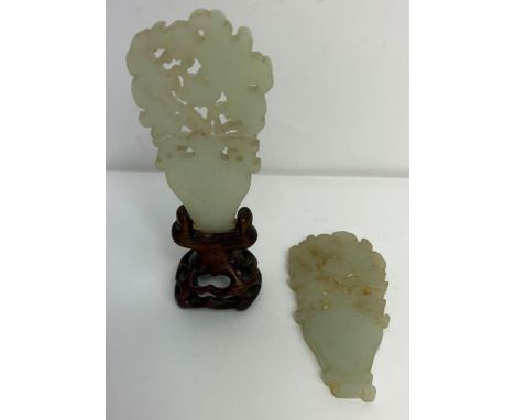 A pair of Chinese white jade carvings, each of flowers in a vase, possibly 18th century, 7cm x 3.8cm 