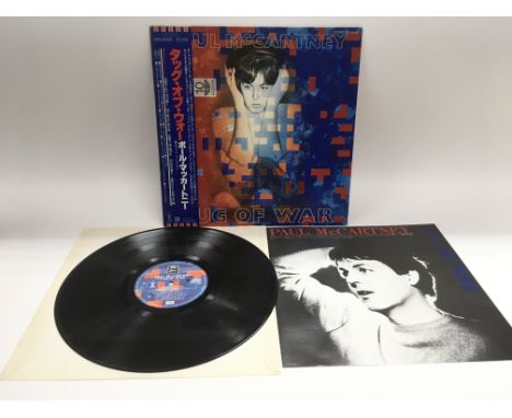 A Japanese import pressing of 'Tug Of War' by Paul McCartney. Complete with obi strip and inserts. N/M. NO RESERVE.