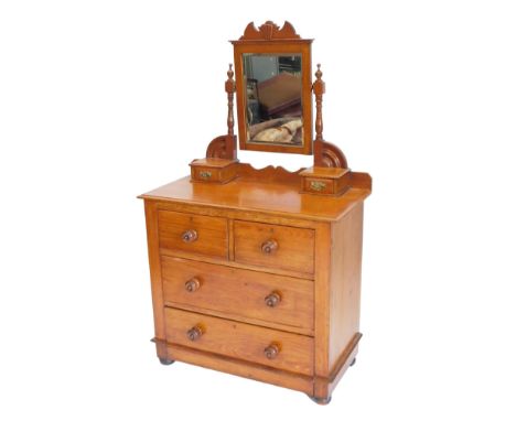 A late 19thC teak dressing chest, the top with a bevelled plate on turned supports above two trinket drawers, the base with a