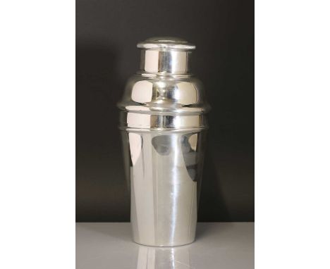 A William Suckling silver-plated cocktail shaker,1930s, of tapering form, with a lemon-squeezer and perforated collar and cov