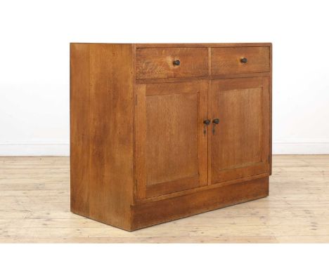 A Gordon Russell oak sideboard, c.1938, design no. 1048, the rectangular top over a parallel pair of drawers, and a set of cu