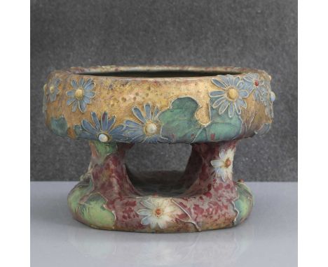 An Austrian Amphora pottery centrepiece, c.1905, moulded with flowers, with a mottled purple and gold ground, impressed marks