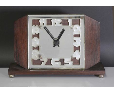 An Art Deco ATO Clock Company mantel clock, with a mirrored and moulded glass and bevelled dial, etched 'ATO', with a Léon Ha