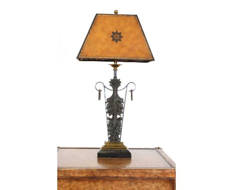 A cast metal and marble table lamp, by Maitland-Smith, with an embossed leather shade, polished brass details and raised on a