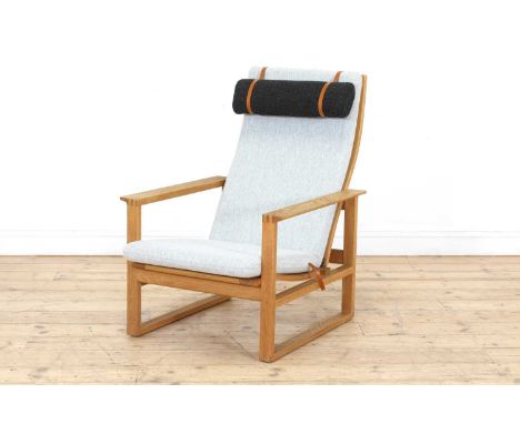 A Danish 'Model 2254' oak sled lounge chair,designed by Børge Mogensen in 1956, with a grey seat and back, and a dark grey he